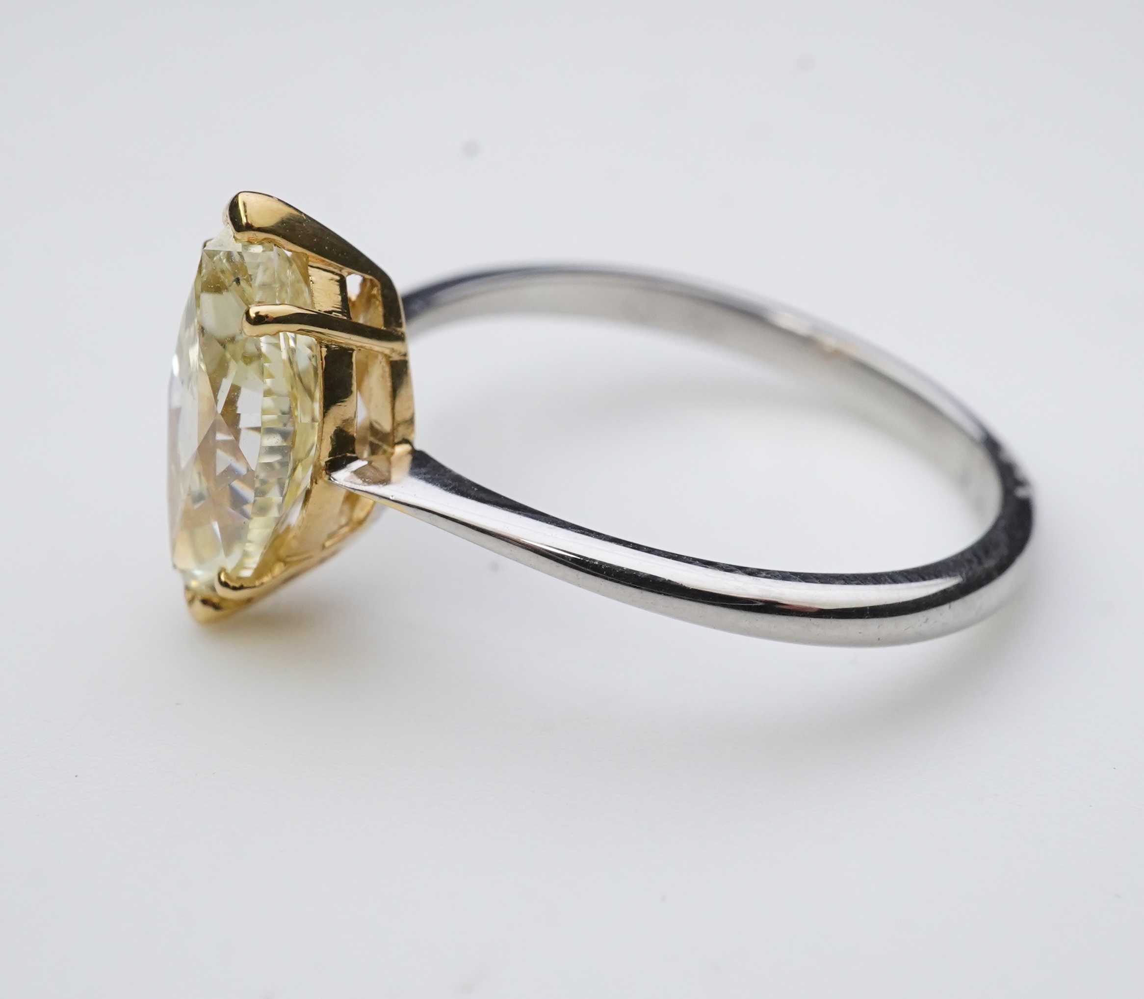 A yellow diamond solitaire ring